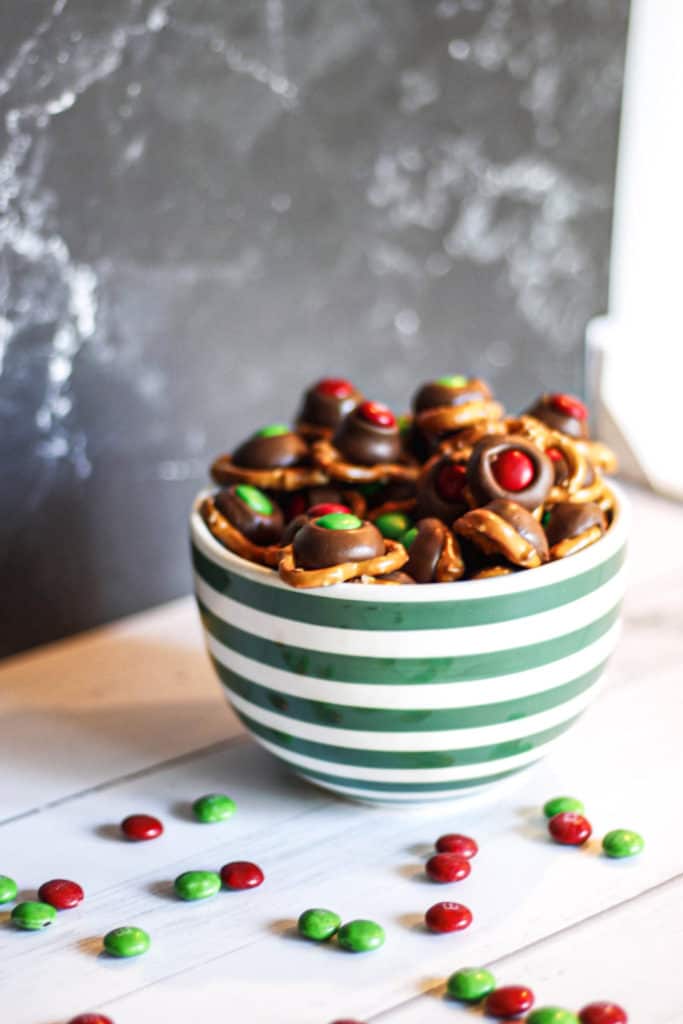 pretzels with chocolate and M&M toppings in a bowl