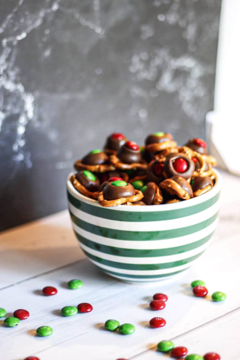 pretzels with chocolate and M&M toppings in a bowl