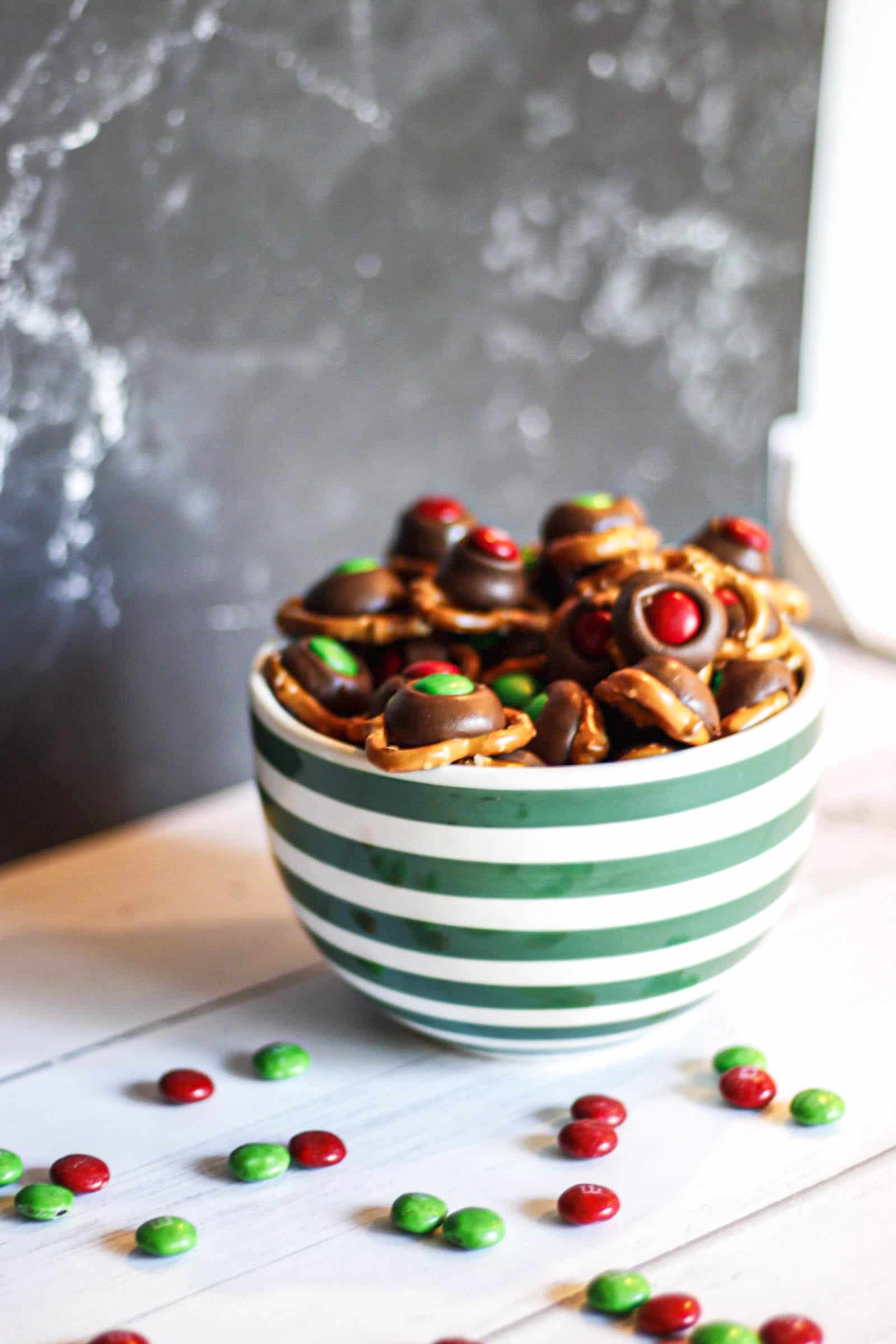 pretzels with chocolate and M&M toppings in a bowl