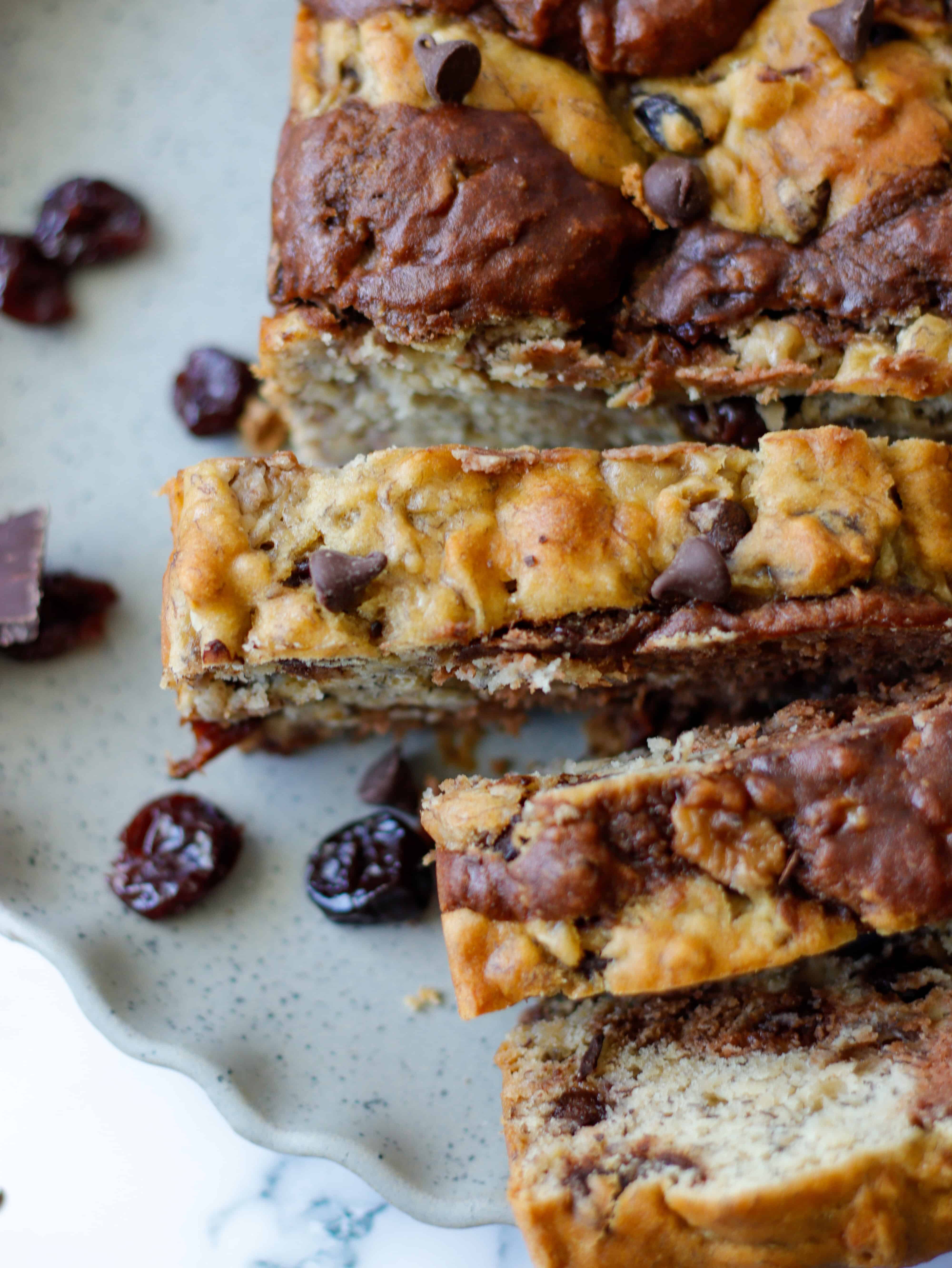 close up of zebra stripped bread cut in to slices with dried cherries 