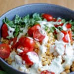 Bowl of lentils, tomato, basil and a creamy dill dressing