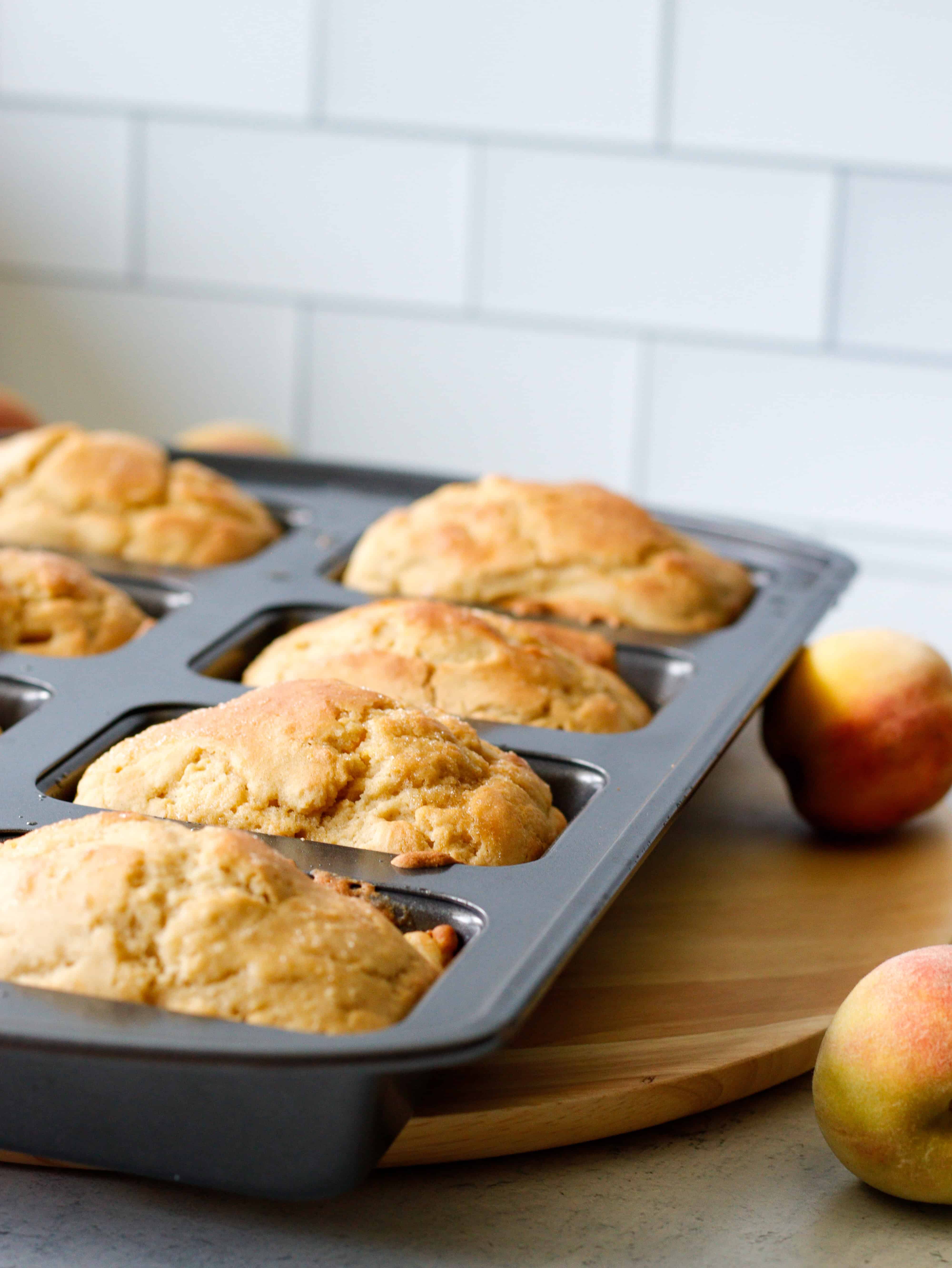Mini peach cakes in a pan