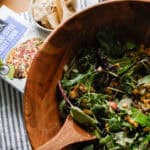 Overhead view of a large salad in a wooden bowl
