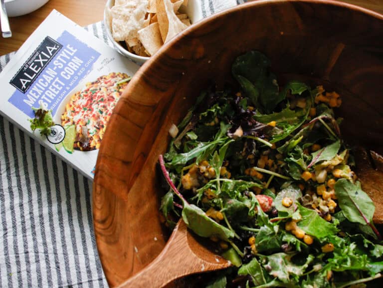Overhead view of a large salad in a wooden bowl
