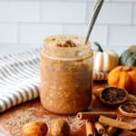 Pumpkin flavored overnight oats in a jar on the table