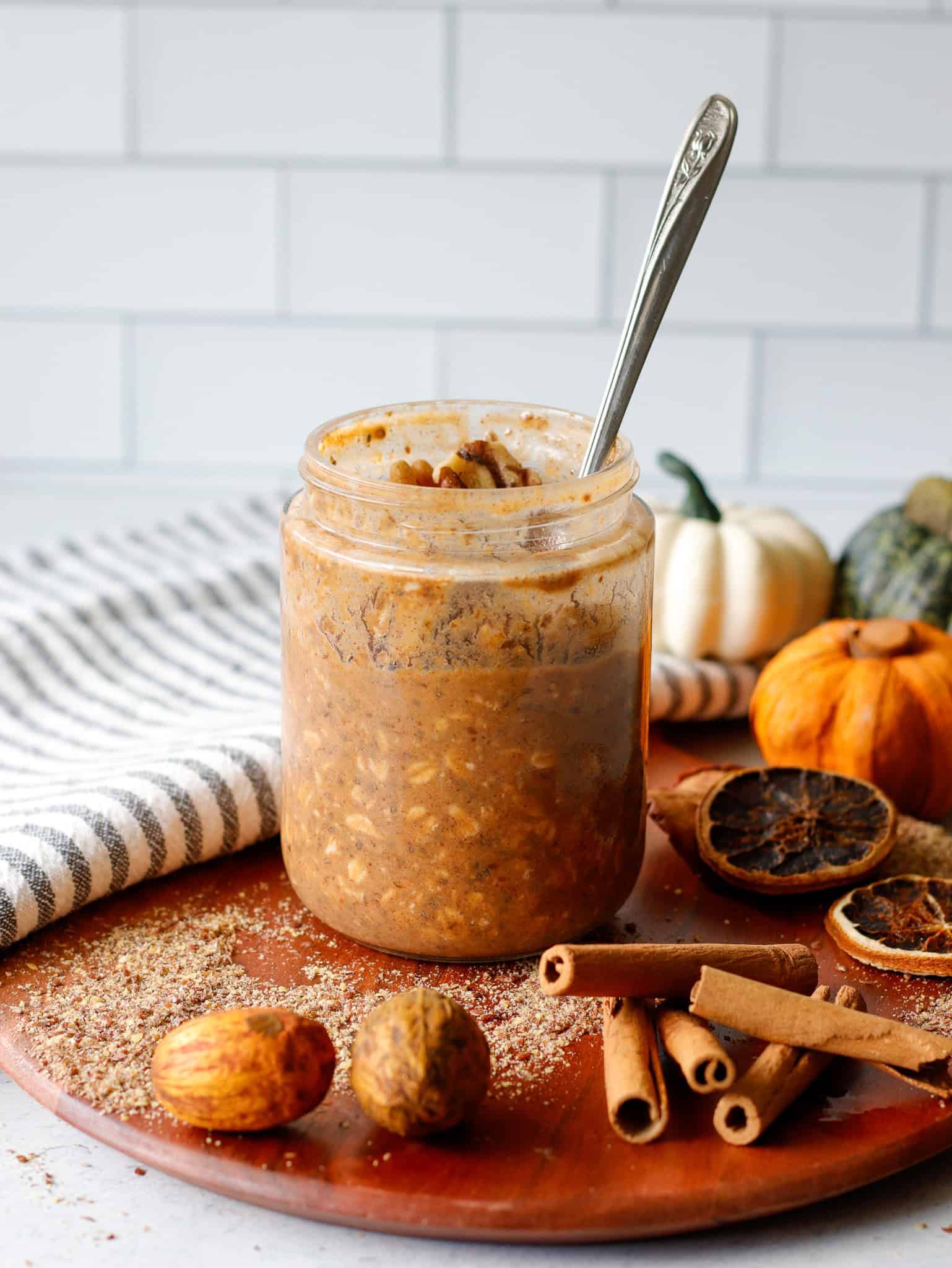 Pumpkin flavored overnight oats in a jar on the table
