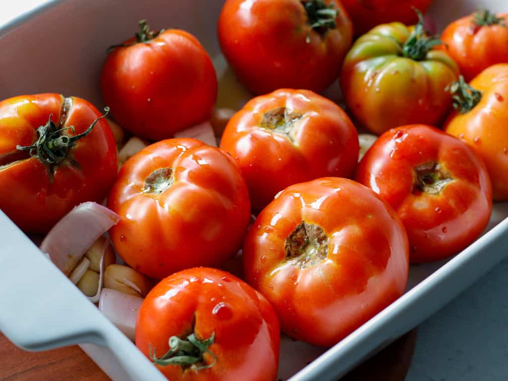 Tomatoes in a white baking dish 
