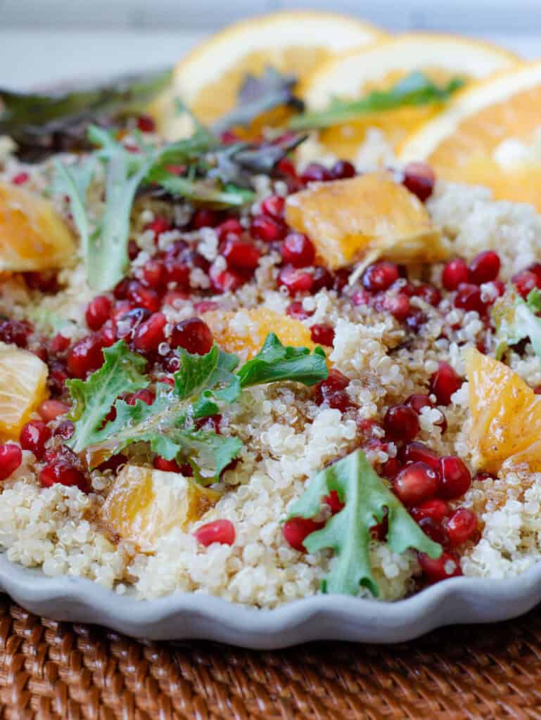Quinoa salad plated with orange slices