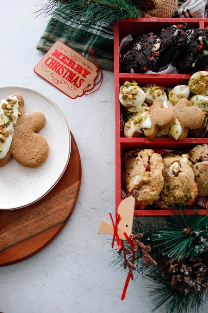 box of cookies and a plate with a gingerbread cookie on top