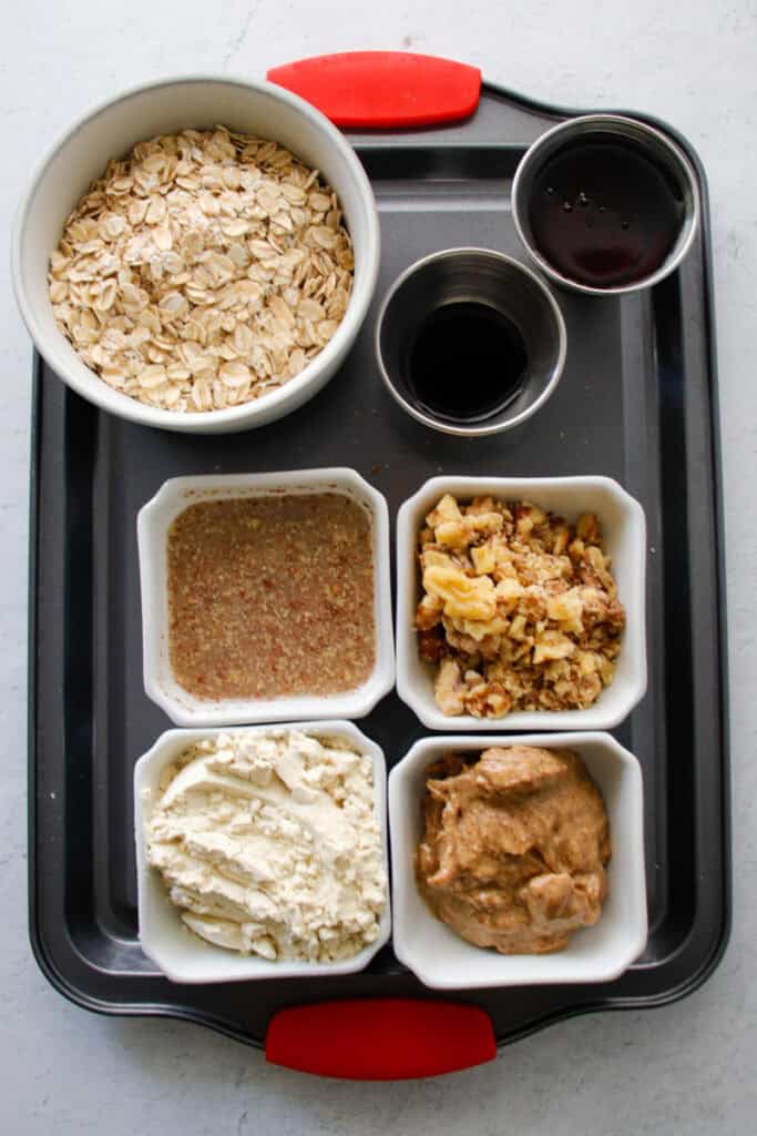 Baking dish with various ingredients in individual bowls