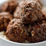 White bowl filled with chocolate peppermint oat balls