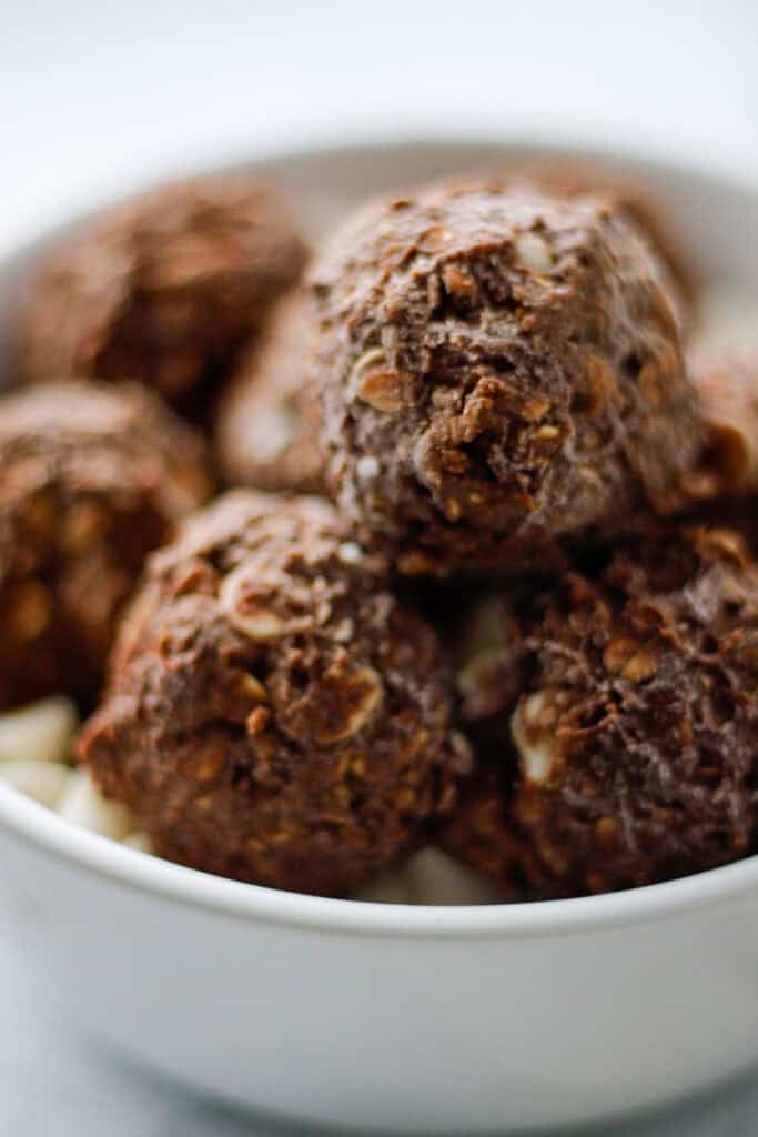 White bowl filled with chocolate peppermint oat balls