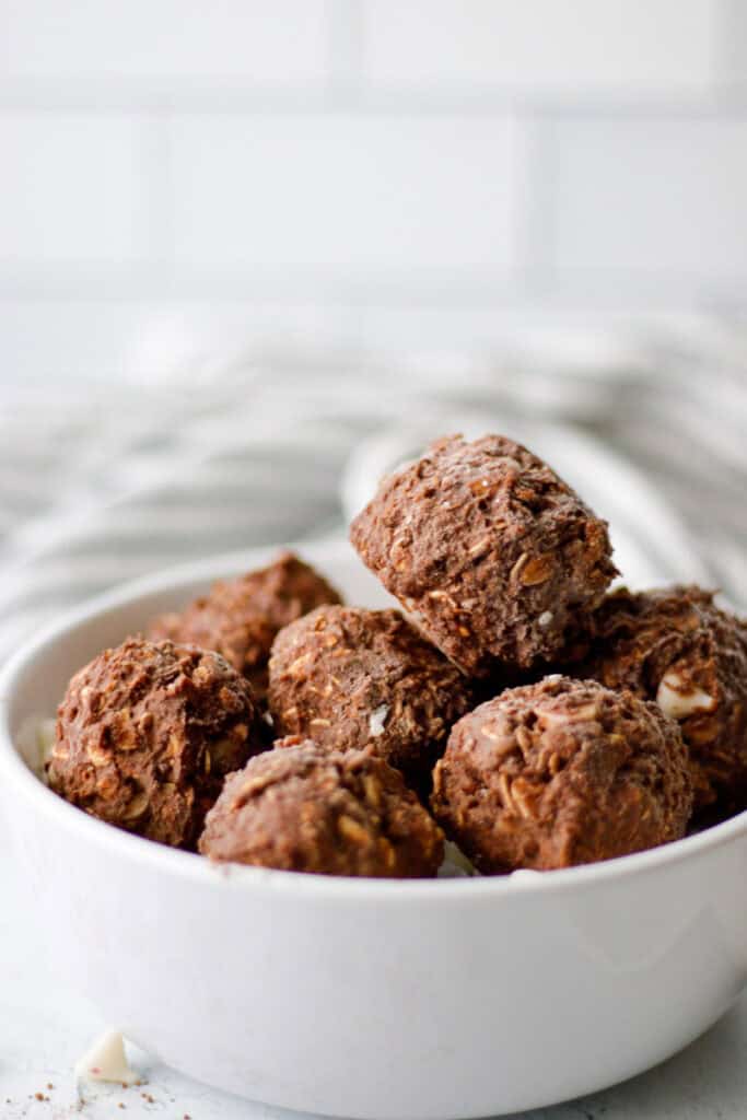 White bowl filled with chocolate peppermint oat balls