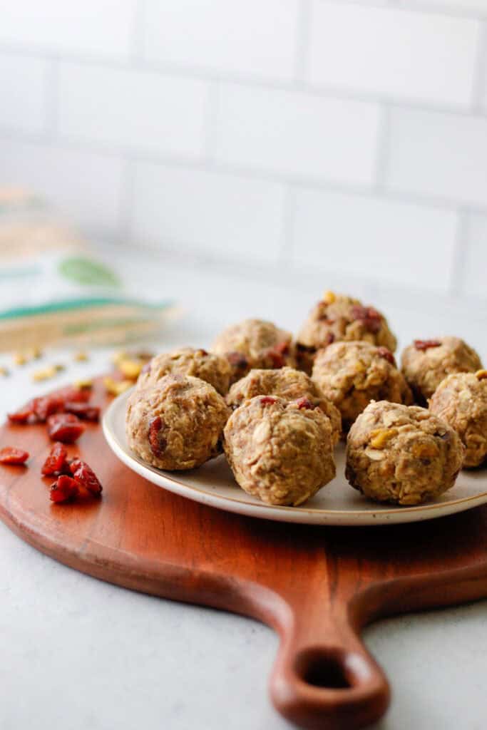 Oatmeal balls with cranberry and pistachios on a plate