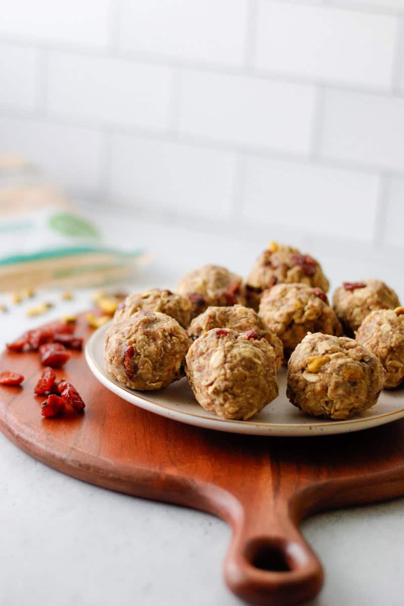 Oatmeal balls with cranberry and pistachios on a plate