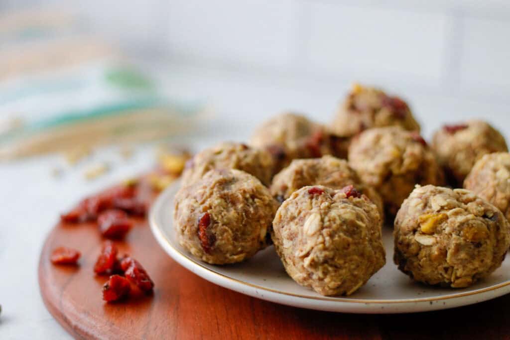 Oat balls and dried cranberries on a plate