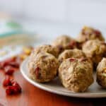 Oat balls and dried cranberries on a plate