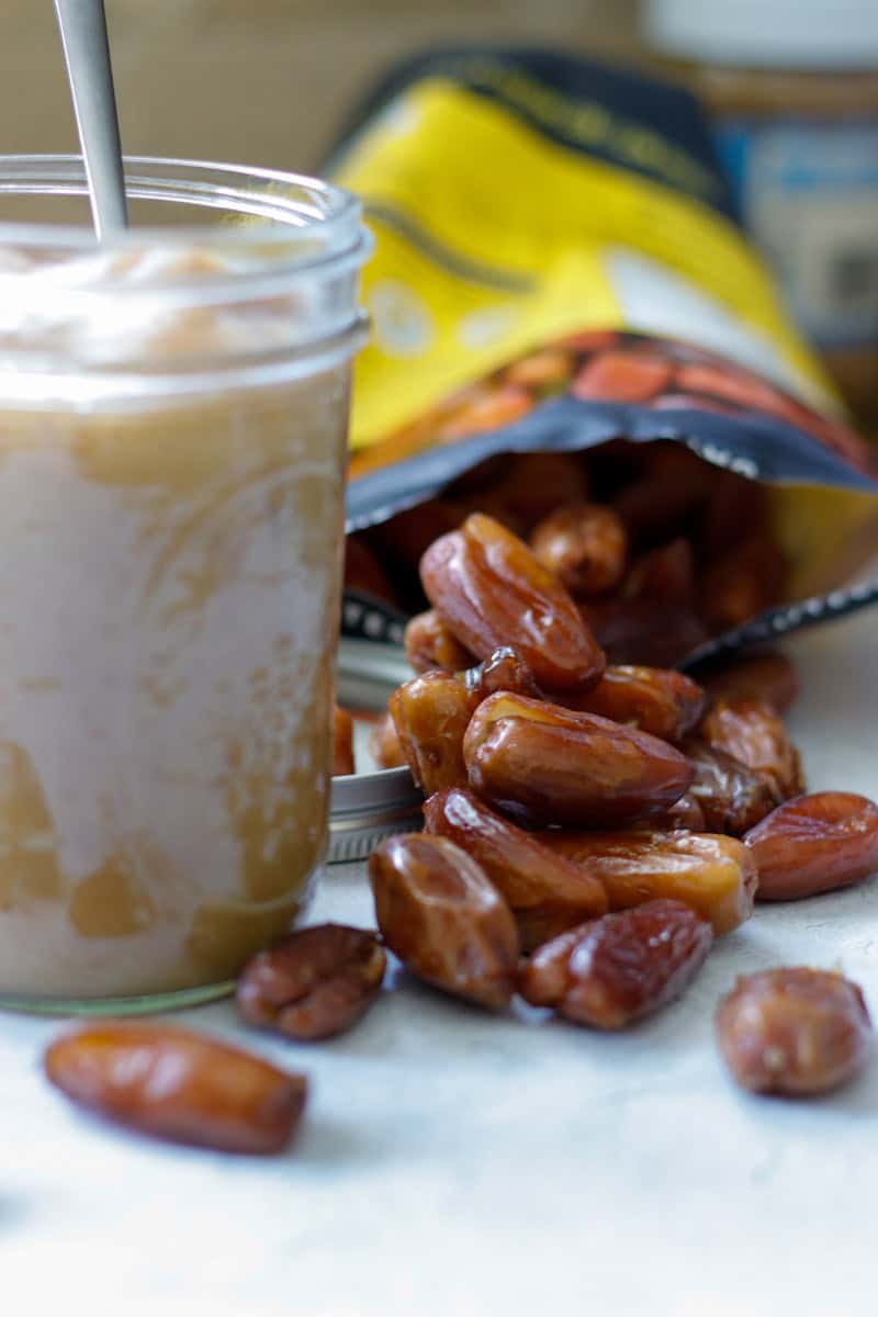 Bag of pitted medjool dates spilled over