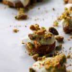 bite sized gingerbread cookies with white chocolate and pistachio topping