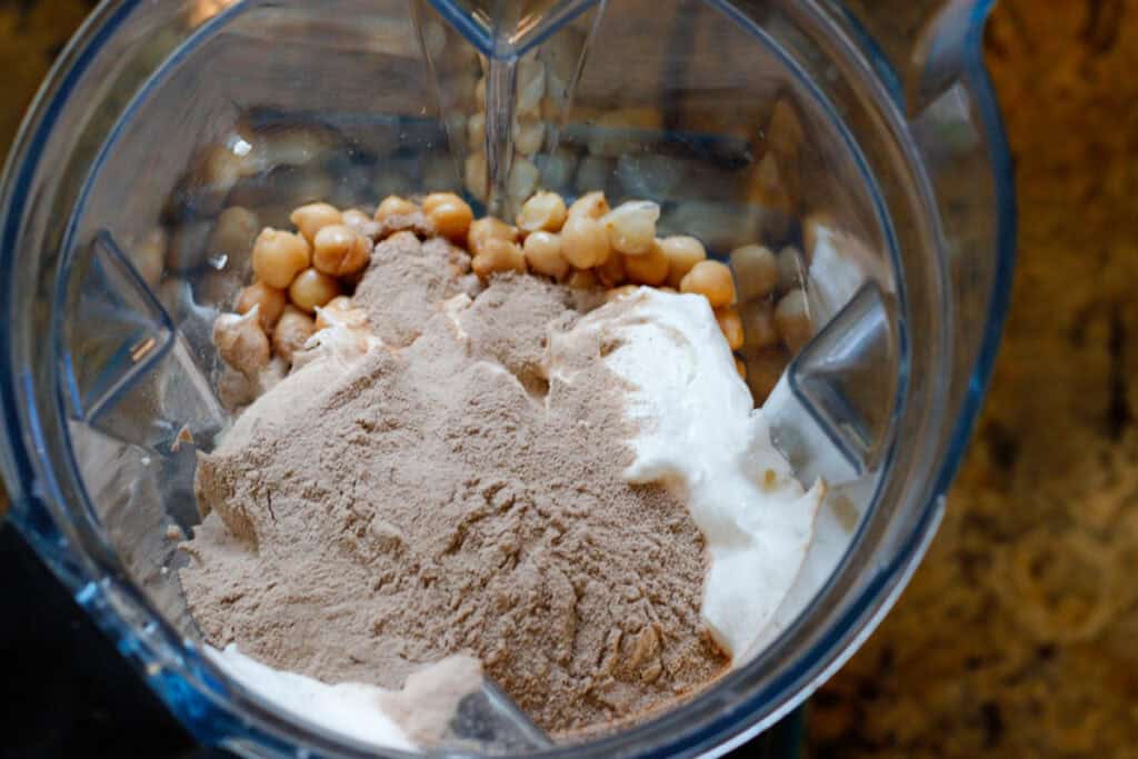 ingredients in a blender for high protein hot chocolate dip