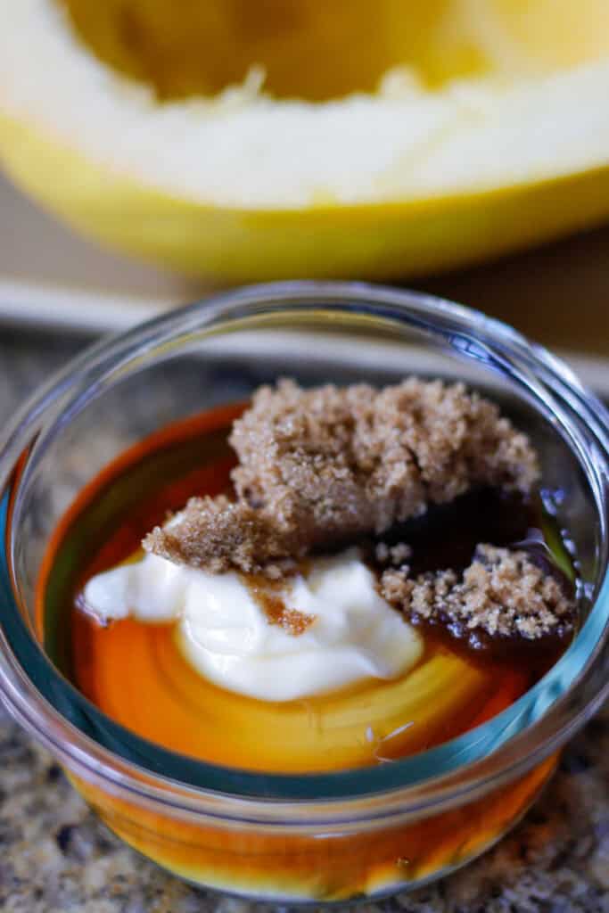 brown sugar, syrup and mayo to make maple aoli in a glass dish