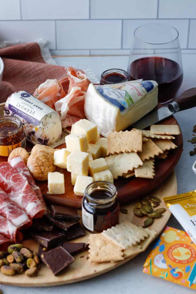 Easy cheeseboard with curated meat, cheese, chocolate, and jams