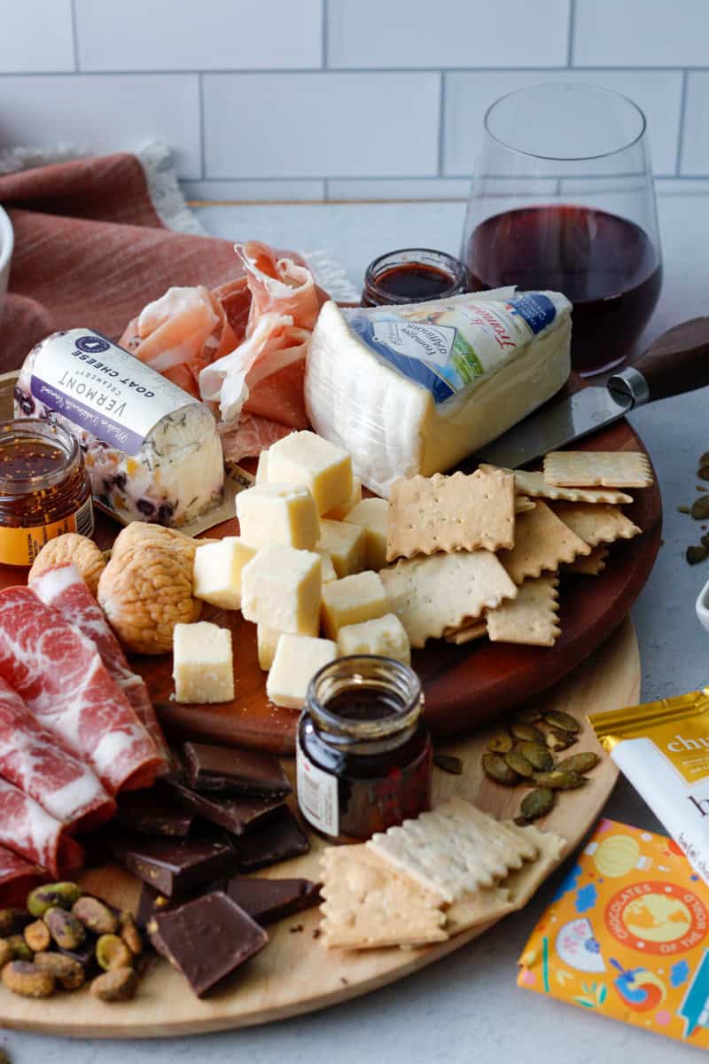 Easy cheeseboard with curated meat, cheese, chocolate, and jams