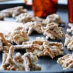 white chocolate pretzel peanut stacks on a black tray