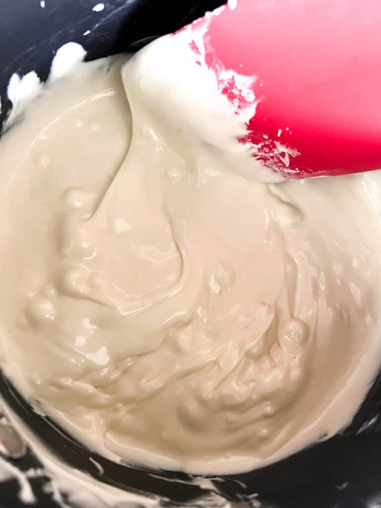 melting white chocolate in a sauce pan