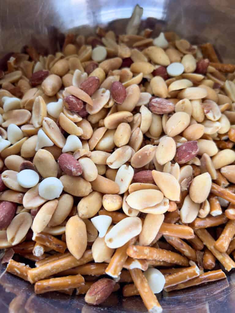 Pretzels and peanuts in a large mixing bowl