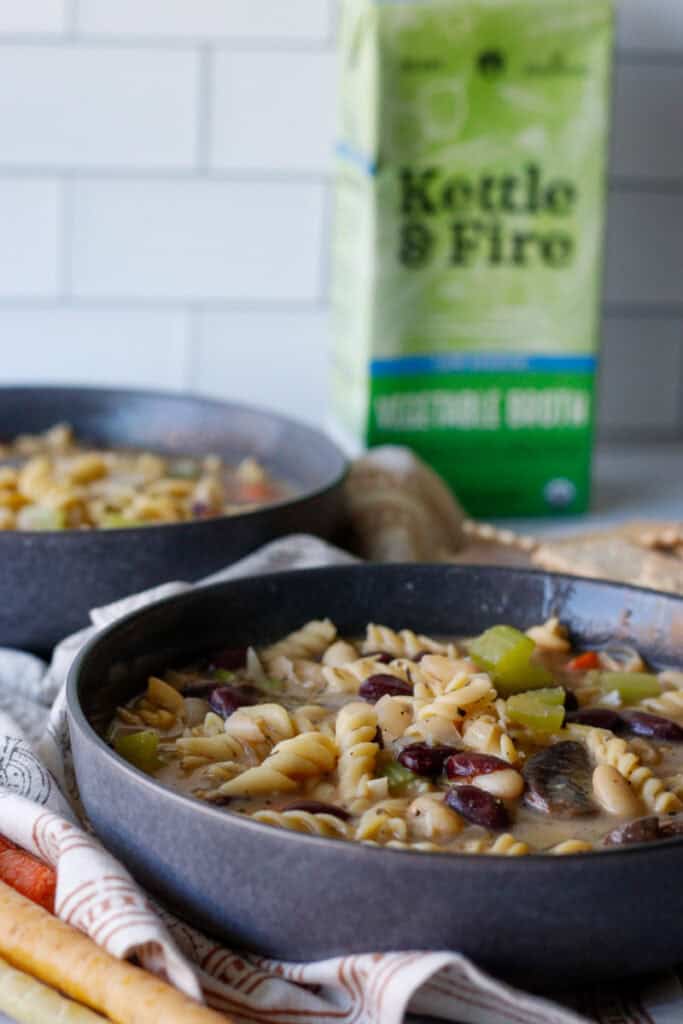 soup in bowls with vegetable broth carton in the back