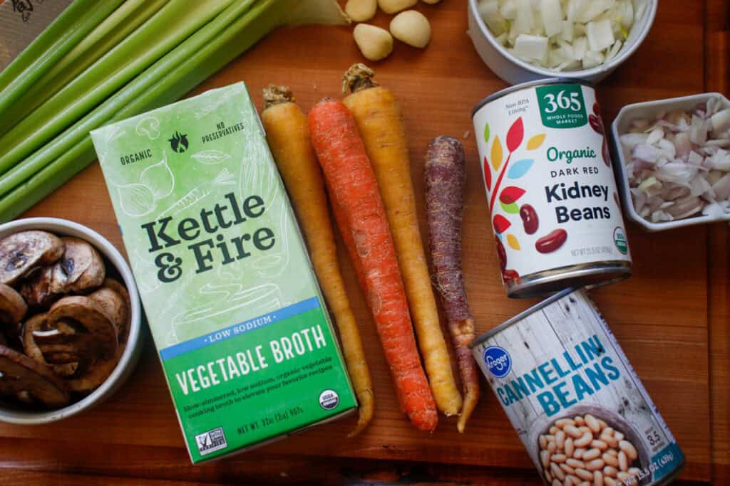ingredients on a cutting board for vegan chickpea noodle soup