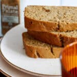 Close up on stacked sliced pumpkin bread on a plate