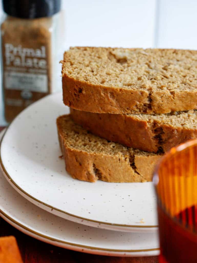 Close up on stacked sliced pumpkin bread on a plate