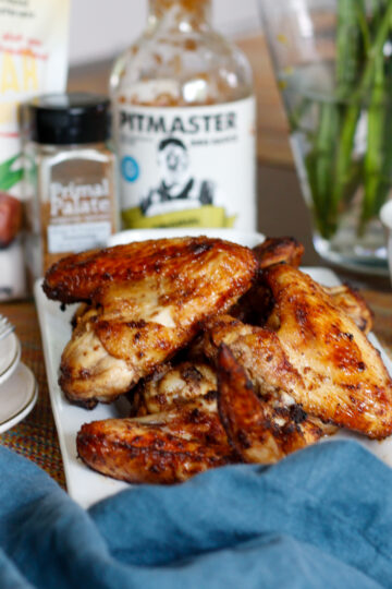 Close up of chicken wings on a plate stacked