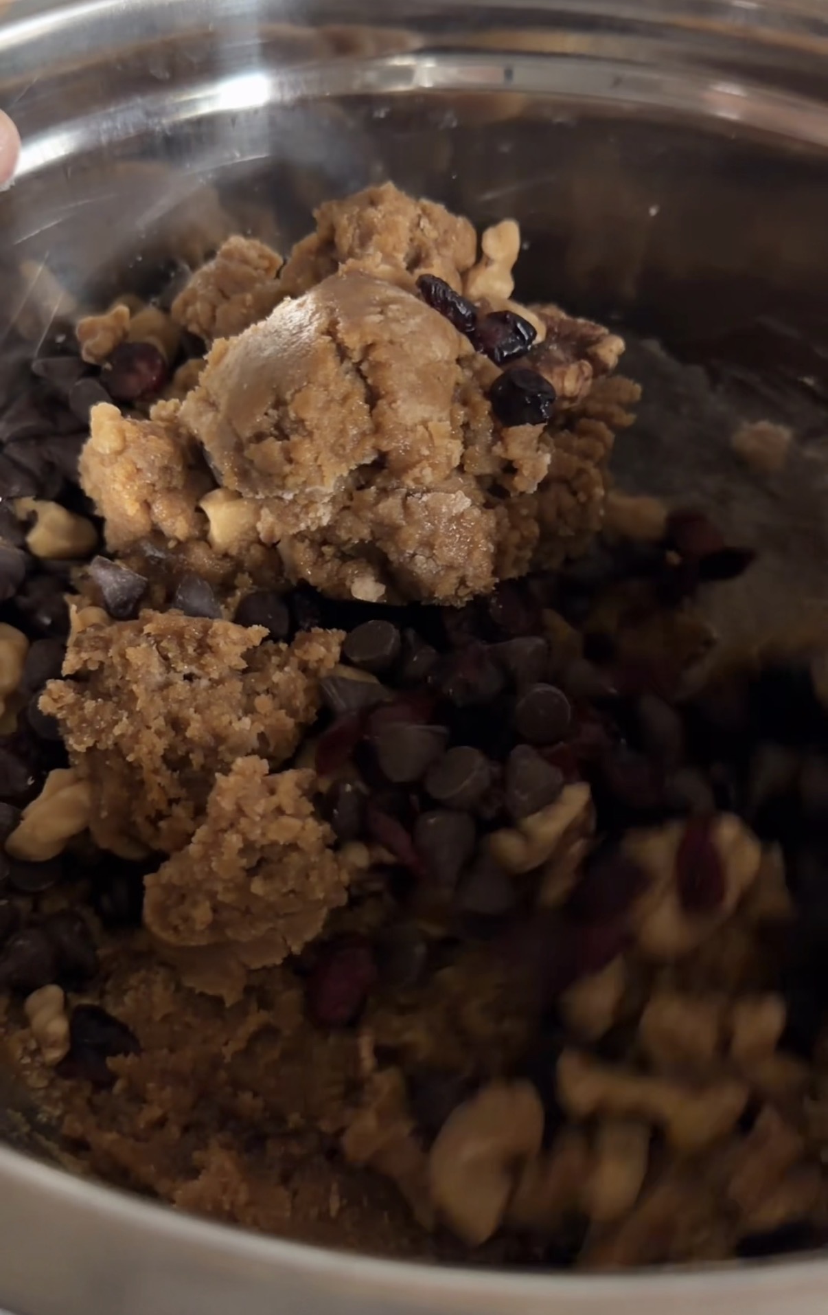 mixing ingredients together in a bowl for pumpkin chocolate chip cookies
