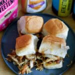 overhead of slow cooker honey mustard sliders on a plate