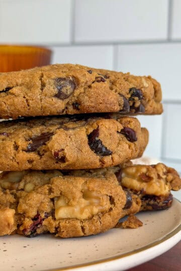 Chewy pumpkin chocolate chip cookies with cranberries and walnuts