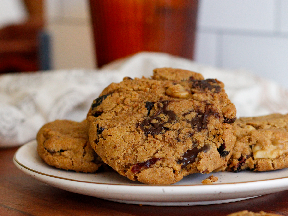 Chewy pumpkin cookies piled on a white plate